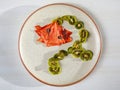 Dried thin slices, green kiwi and red watermelon fruit chips in shape of flower Royalty Free Stock Photo