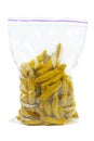 Dried turmeric rhizomes in plastic packet on a white Royalty Free Stock Photo