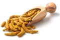 Dried turmeric root in the olive wood scoop, isolated on white