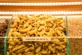 Dried turmeric roots and powder on countertop for selling in spice bazaar Royalty Free Stock Photo