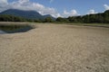 Dried up or arid muddy bottom of the water dam Liptovska Mara during very drought summer weather.