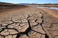 a dried-up pond with cracks in the muddy surface