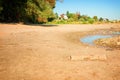 Dried up river bed, beach without water. Low water level of the Rhein dry river landscape, photo On the banks of the Rhine dried o Royalty Free Stock Photo