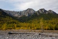 Dried up river bed in a rural countryside with the mountains in the background. Majestic landscape with the rock road and hills Royalty Free Stock Photo