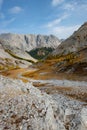 Dried up river bed in a rural countryside with the mountains in the background. Majestic landscape with the rock road and hills Royalty Free Stock Photo