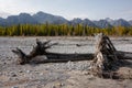 Dried up river bed in a rural countryside with the snowy mountains in the background. Majestic landscape with the rock road and Royalty Free Stock Photo