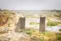 Dried up river and supports of the old bridge Royalty Free Stock Photo