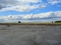 A dried-up riverbed of the salt lake desert the naked bottom of the reservoir in Kazakhstan with storm clouds nature landscape Royalty Free Stock Photo