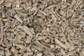 Dried Valerian root pieces (Valeriana officinalis), closeup background image.