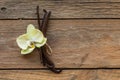 Dried vanilla pods and orchid vanilla flowers on wooden background.vanilla sugar Royalty Free Stock Photo