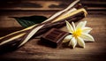 Dried vanilla sticks and vanilla orchid on wooden table. Close-up.