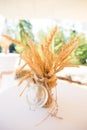 Dried Wheat Ears in Glass Conserve Jar in Shabby Chic Rustic Wed Royalty Free Stock Photo