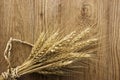 Dried Wheat Stalks on Wood Royalty Free Stock Photo