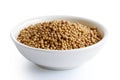 Dried white mustard seeds in white ceramic bowl isolated on whit Royalty Free Stock Photo