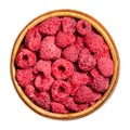 Dried whole raspberries in a wooden bowl