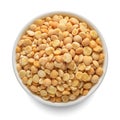 Dried yellow peas in white bowl isolated on white. Top view Royalty Free Stock Photo