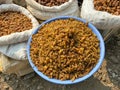 Dried yellow raisins on the counter. Dried fruits in a bazaar in India