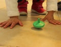 Jewish traditional chanuka toy. Children playing with colorful driedles.