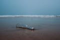 Drift bottle on the beach Royalty Free Stock Photo