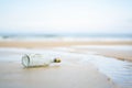 A drift bottle on the coast Royalty Free Stock Photo