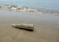 A drift bottle washed up on the coast Royalty Free Stock Photo