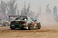 Drift cars team Round-X enters the bend with slip Royalty Free Stock Photo