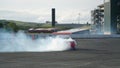 Racing car drift with smoking tyres Royalty Free Stock Photo