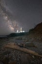 Driftwood and Milky Way Galaxy over Montauk Lighthouse in New York Royalty Free Stock Photo