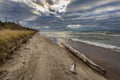 Driftwood on a Lake Huron Beach Under a Cloudy Sky