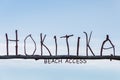 Driftwood letters at Hokitika beach in New Zealand