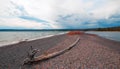 Driftwood log on small isthmus called Hard Road to Follow on banks of Yellowstone Lake in Yellowstone National Park - Wyoming USA