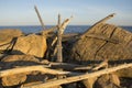 Driftwood stacked on glacial boulders, Hammonasset Beach, Madiso Royalty Free Stock Photo