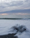 Driftwood, waves and sunset Royalty Free Stock Photo