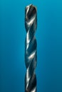 Drill Bit Close Up On Blue Background Royalty Free Stock Photo