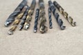 Different Types of Drill Bits. Old and worn-out drill bits in various sizes Royalty Free Stock Photo