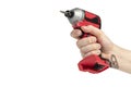 Drill in hand on a white isolated background. Cordless drill or screwdriver in a male hand. Removable lithium battery Royalty Free Stock Photo