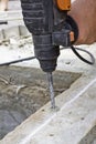 Construc worker fixing the pavestone on the roadtion worker installing stone blocks on pavement