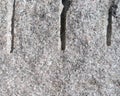 Drill holes in a cut granite block close view