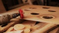 Drill with a round nozzle in a carpentry workshop