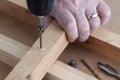 Drill screw and countersink wood on work bench Royalty Free Stock Photo