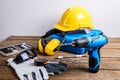 Drill and set of drill,tools,carpenter and safety, Protection Equipment Royalty Free Stock Photo