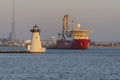 Drill ship Fugro Explorer passing Palmer`s Island lighthouse Royalty Free Stock Photo