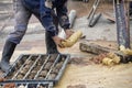 Driller obtaining soil samples in plastic core box