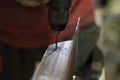 Drilling a hole in the steel. Working as a metal tool Royalty Free Stock Photo