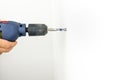 Drilling hole in the wall Royalty Free Stock Photo