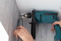 Drilling a hole in a wall using drill