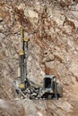 Drilling holes for demolition in a quarry Royalty Free Stock Photo