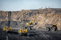 Drilling machine borer installing cast explosives blasting. Open coal mine