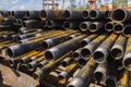 Drilling of oil and gas wells. Drill pipe inspection. Tubing for oil and gas listed on the pedestal out of the wells after washing Royalty Free Stock Photo