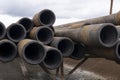 Drilling pipe. Rusty drill pipes were drilled in the well section. Laying the pipe on the deck. View of the shell of drill pipes